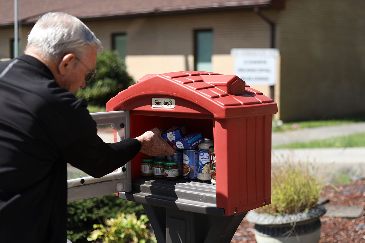 Resident in Cowen, WV refills the local blessing box