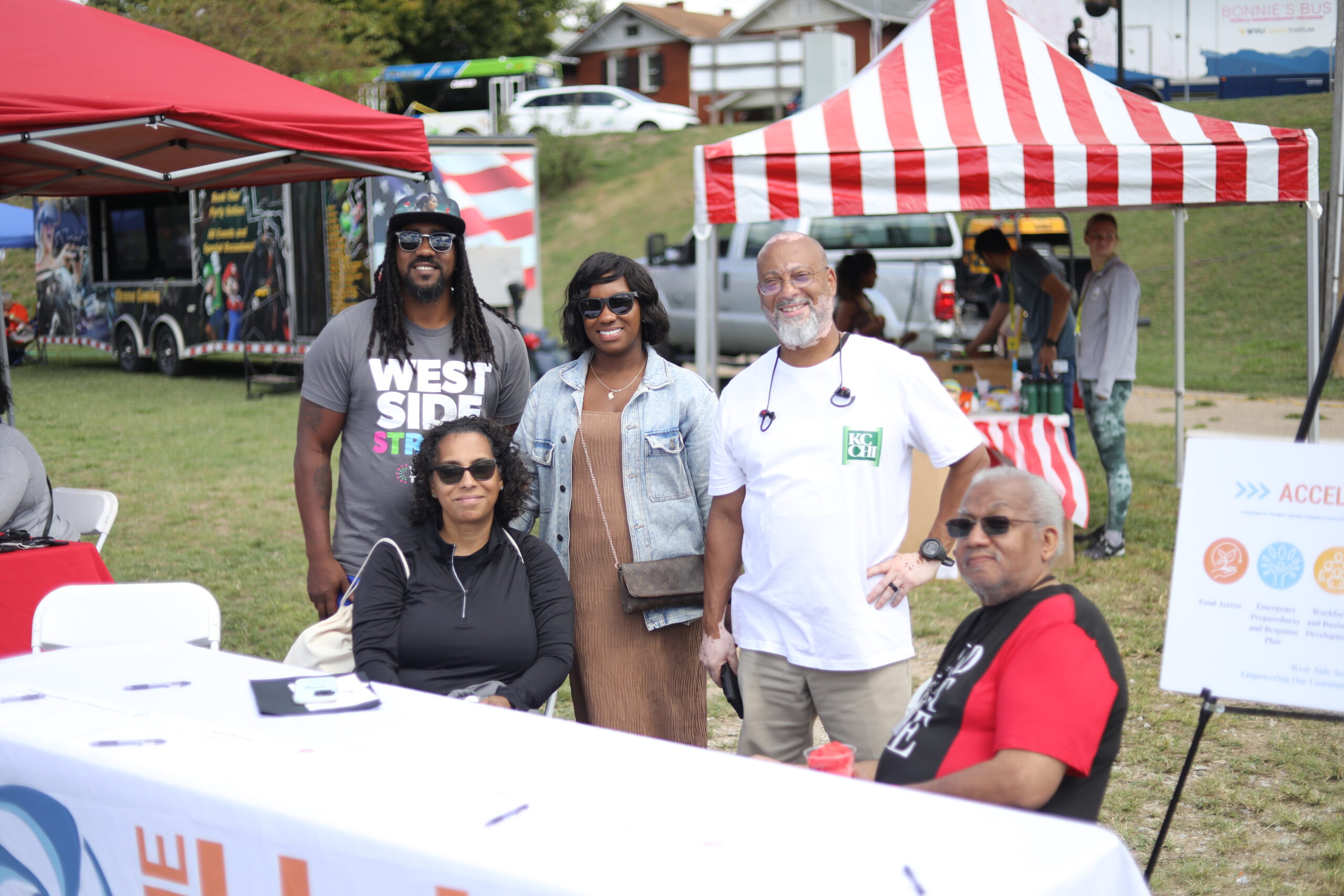 Members of the West Side of Charleston Accelerate WV community team engage with community members at West Side Health Fair.